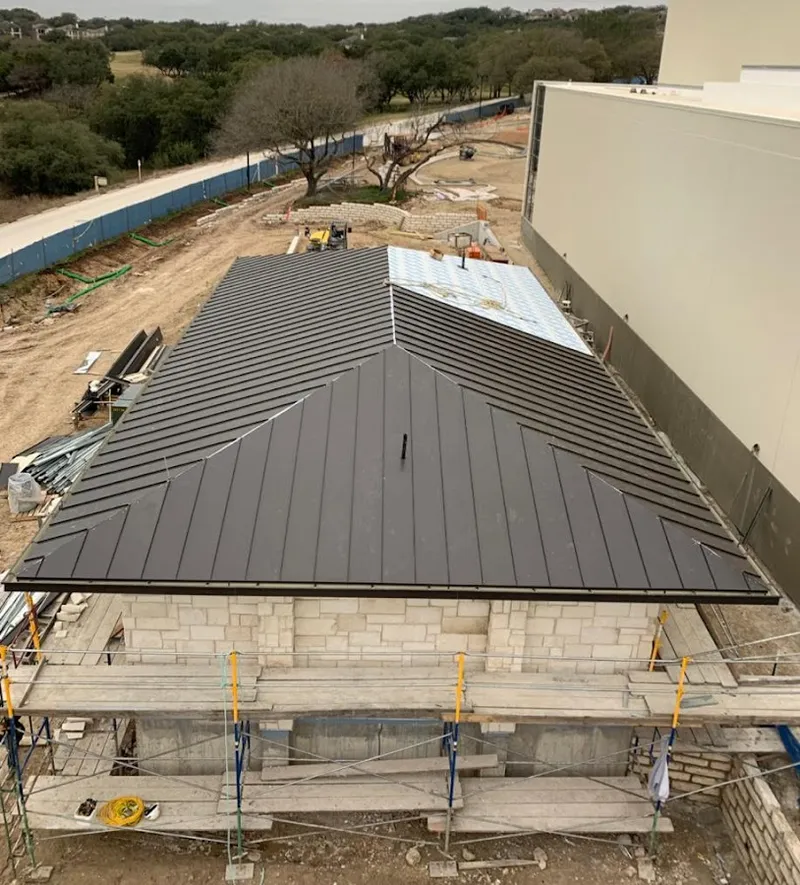 Metal roof new construction with scaffolding in Green Hill